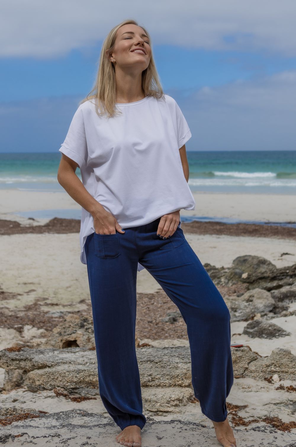 white top Australian made. Navy blue pants. Cotton wear for woman